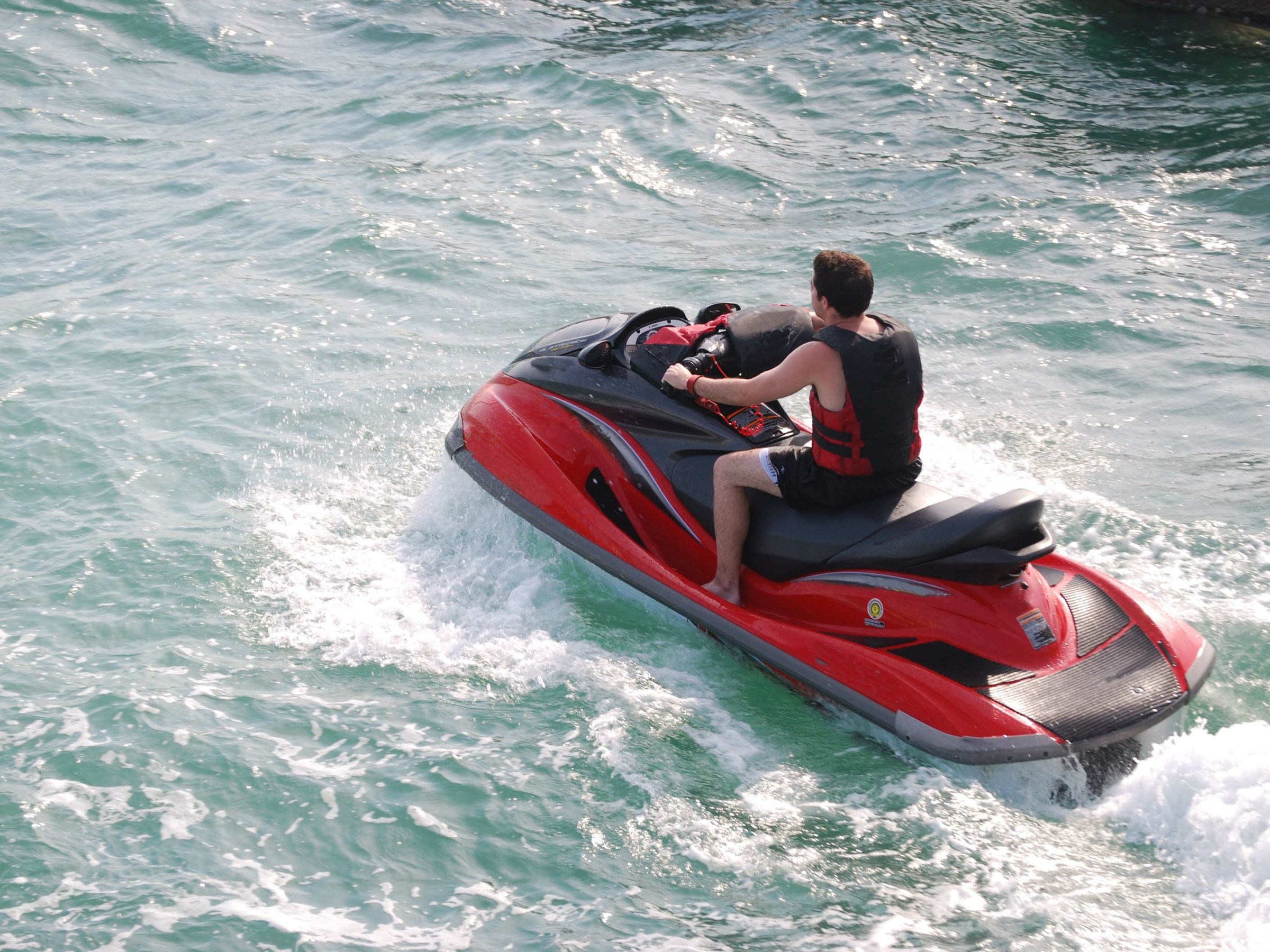 a man riding a wave on a surfboard in the ocean