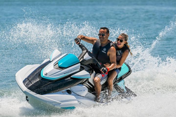 a man riding a wave on a surfboard in the water