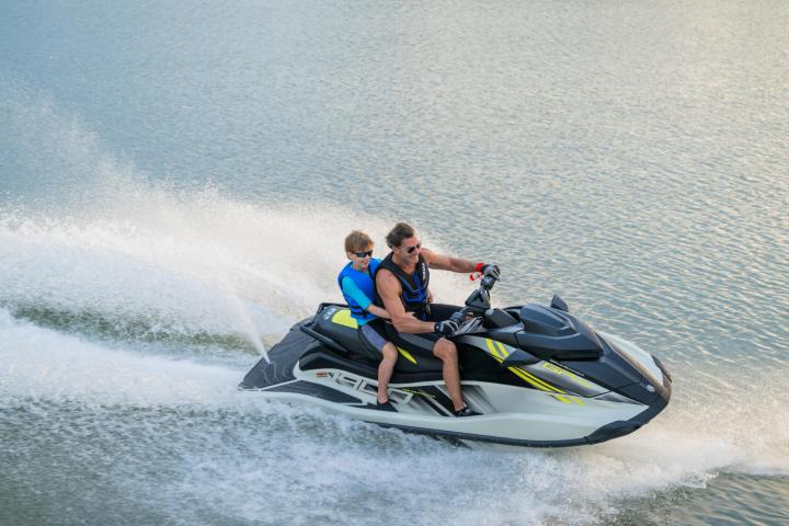 a man riding a wave on top of a body of water